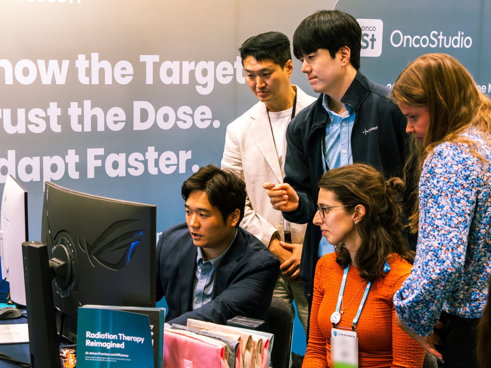Demonstrating OncoStudio to visiting clinicians at the Oncosoft booth, AAPM 2026